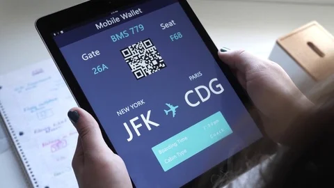 Girl Looking at Her Plane Ticket On Her Tablet Device Screen Stock Footage 80600705
