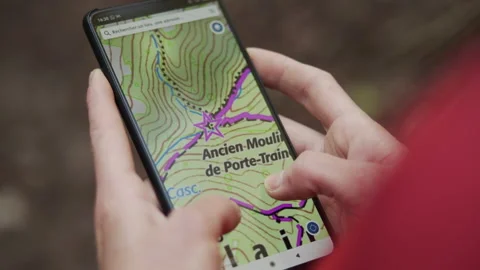 Girl looking at map on a smartphone Video stock 165739643