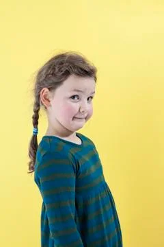 A girl looking mischievously into the camera Stock Photos