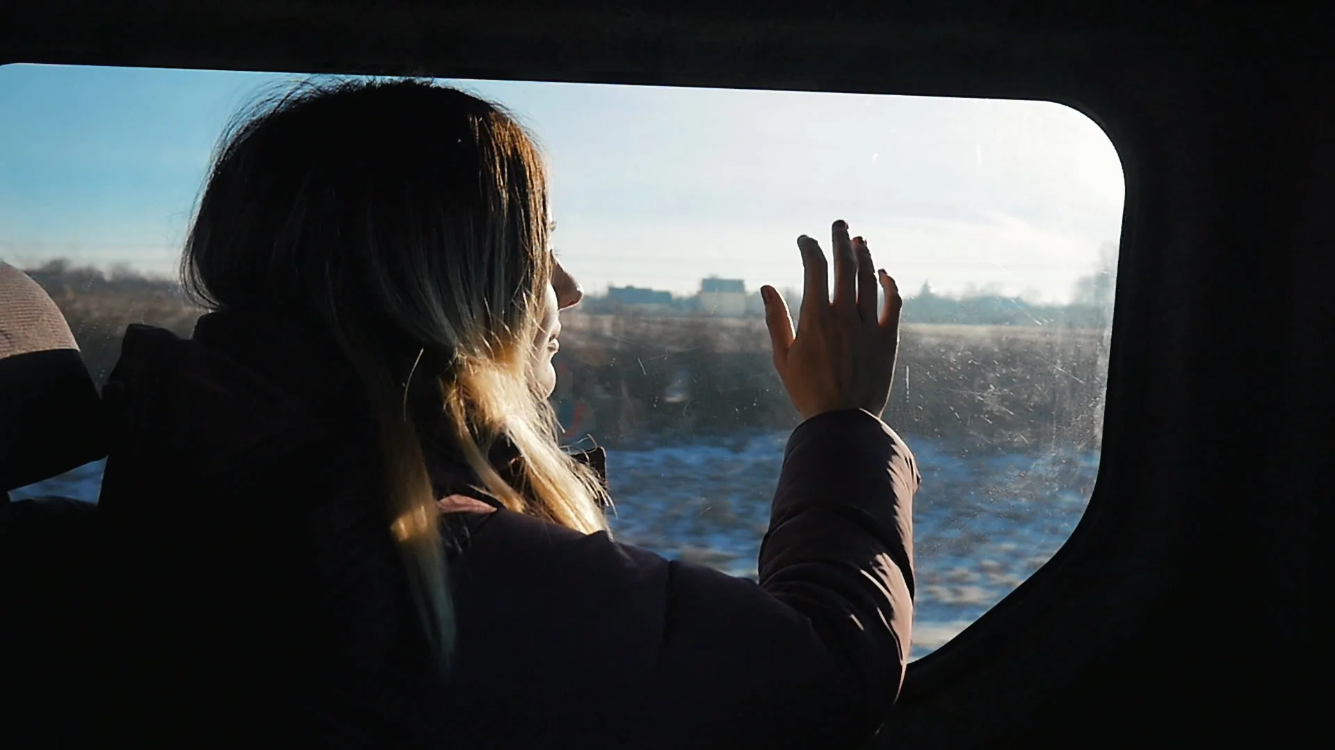 Girl looking out from car window. Sunny ... | Stock Video | Pond5