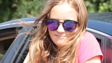 The girl is looking out of the car window Stock-Footage 80446677