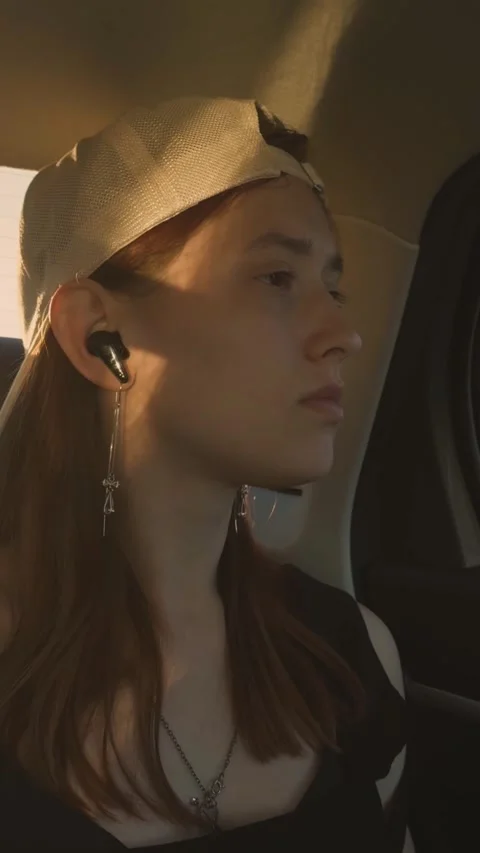 Girl looking out car window, happy family, women dream traveling, listening Stock Footage 293667501