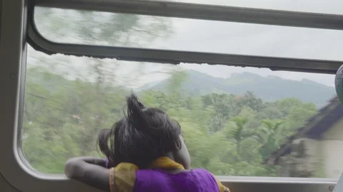 Girl is looking out a train Stock Footage 104192253