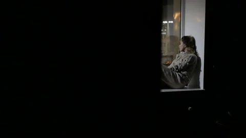 Girl is looking out the window Stock Footage 86113672