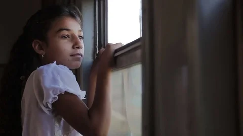 Girl looking out window on train Stock Footage 78884331