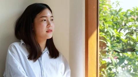Girl looking outside the window.Relaxing time. Stock Footage 101700776