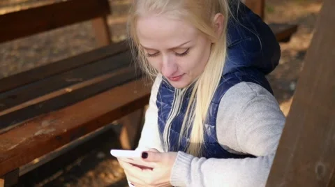 Girl looking at phone Stock Footage 68867006