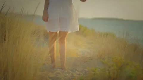 Girl looking for shells Stock Footage 10843637