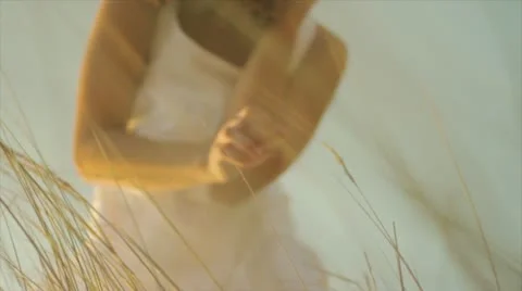 Girl looking for shells 動画素材 10847692