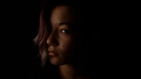 Girl looking off to side then at camera Stock Footage 121242415