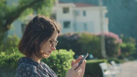Girl is looking in the smartphone.  Stock Footage 78107316