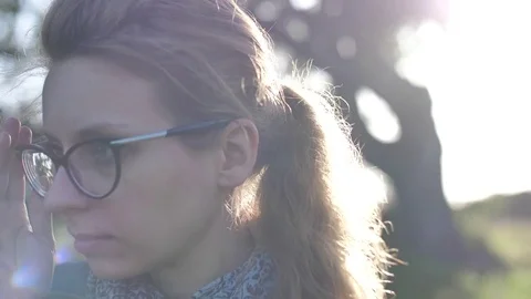 Girl Looking Towards The Setting Sun Stock Footage 82936892