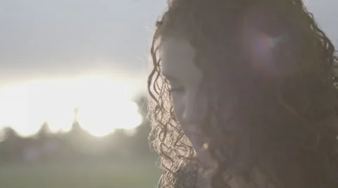 Girl looking off while reading Stock Footage 61961167