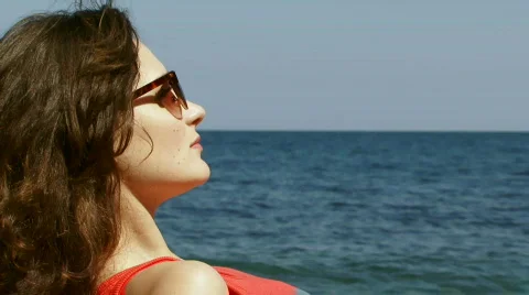 Girl lying on the beach Stock Footage
