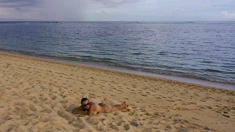 Girl lying on the beach Stock Footage 105916465