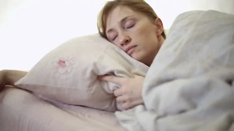 Girl lying in bed Stock Footage 61061713