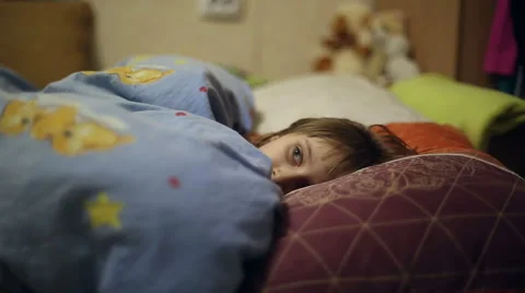 The girl is lying in bed before going to sleep Stock Footage 60351068