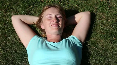 Girl lying on the grass Stock Footage 52435574