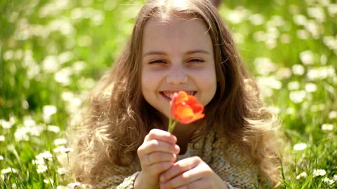 Girl lying on grass, grassplot on background. Tulip fragrance concept. Stock Footage 106591437
