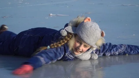 Girl lying on the ice Stock Footage 72581727