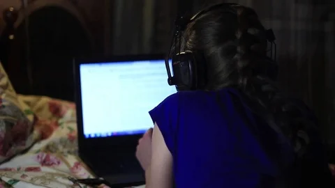 Girl lying with laptop Stock Footage 69865033