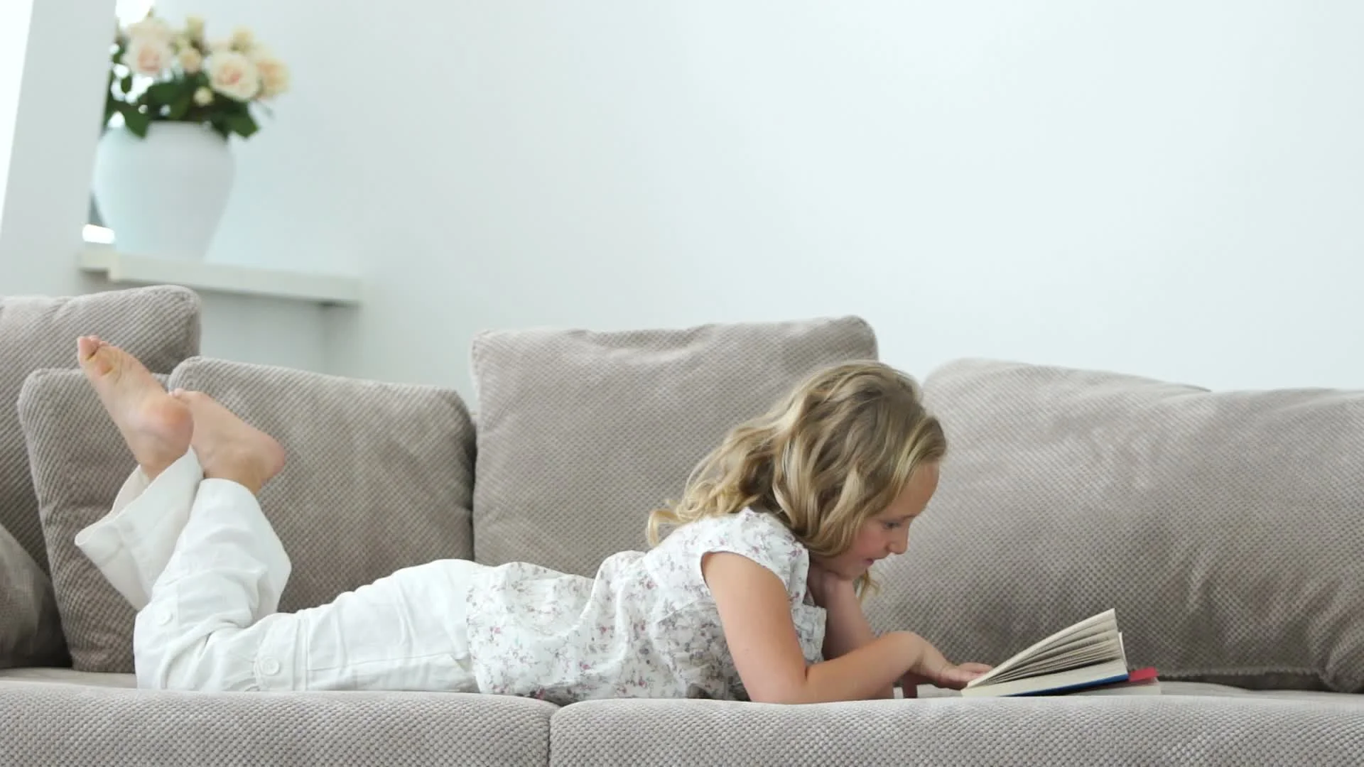 Girl Lying On The Sofa Reading A Book Video 024620220