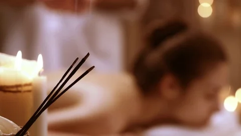 Girl lying in spa resort on massage table. Footage out of focus. Concept of Stock Footage