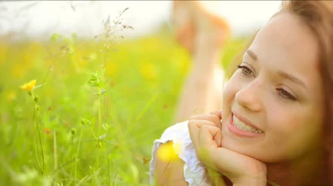 Girl lying on the Spring Meadow Stock Footage 37110839