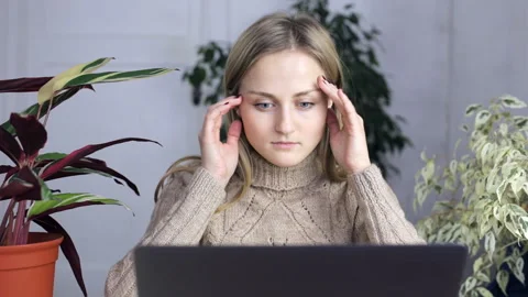 The girl made some mistake while working at a laptop Stock Footage 103793015