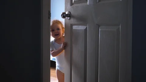 Girl make her first steps indoor. 4k UHD. Slow Motion Vídeos de archivo 87381504