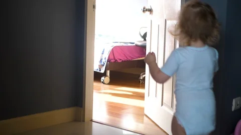 Girl make her first steps indoor. 4k UHD. Slow Motion 스톡 동영상 87422975