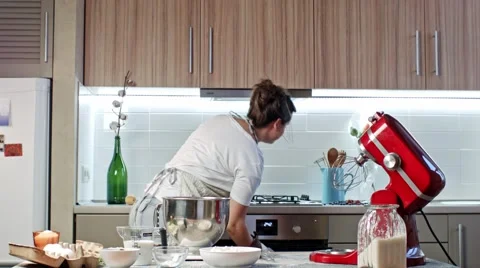 Girl makes dough for cake Stock Footage