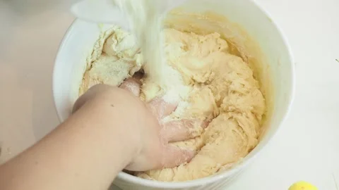 Girl makes a easter biscuit cake in the kitchen. for the Easter holiday 库存影片 150794732