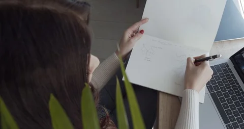 A girl makes notes in her notebook Stock Footage 127850555