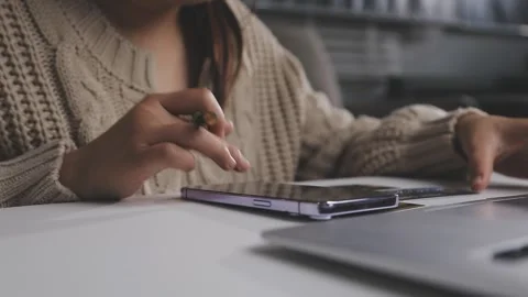 Girl makes a purchase on the Internet on the computer with credit card Stock Footage 313583916