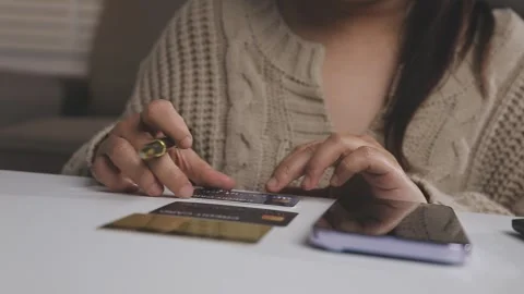 Girl makes a purchase on the Internet on the computer with credit card Stock Footage 313583979