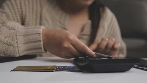 Girl makes a purchase on the Internet on the computer with credit card Stock Footage 313584219