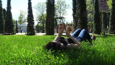 A girl makes a self-portrait using a mobile gadget Stock Footage 79606655