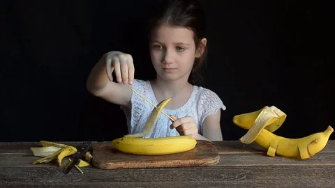The girl makes the ship bananas and plays with it Stock Footage
