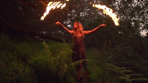 Girl With Makeup Fire Dancing in the Forest Stock Footage 82352666