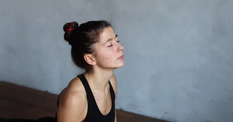 Girl making down dog pose at arm's length Stock-Footage 127740865