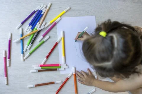 Girl  making a drawing Stock Photos