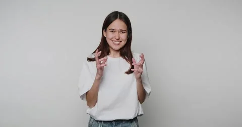 Girl making funny faces while showing different expressions in a studio setti Vídeos de archivo 328248534
