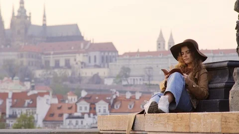 Girl making notes on Charles bridge in Prague Stock Footage 116473199