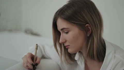 Girl making notes in a notebook Stock Footage 168746511