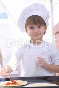 Girl making pizza Stock Photos