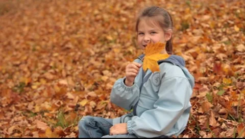 Girl with maple leaf Stock Footage 7762281