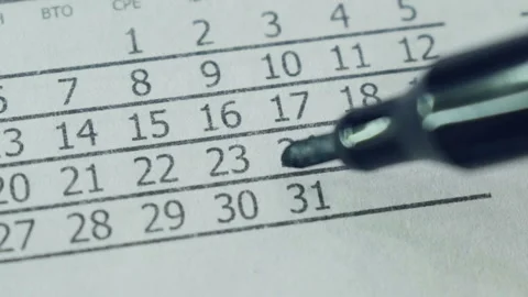 The girl marks the date in the calendar. Video stock 101060827
