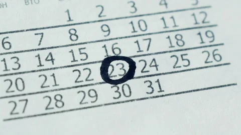 The girl marks the date in the calendar. Video stock 101060837