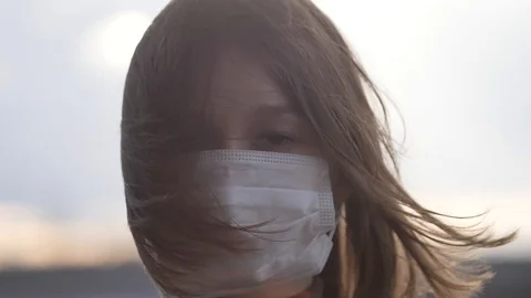 Girl In Mask Slow Motion Front Video During Coronavirus COVID-19 Epidemic Stock Footage